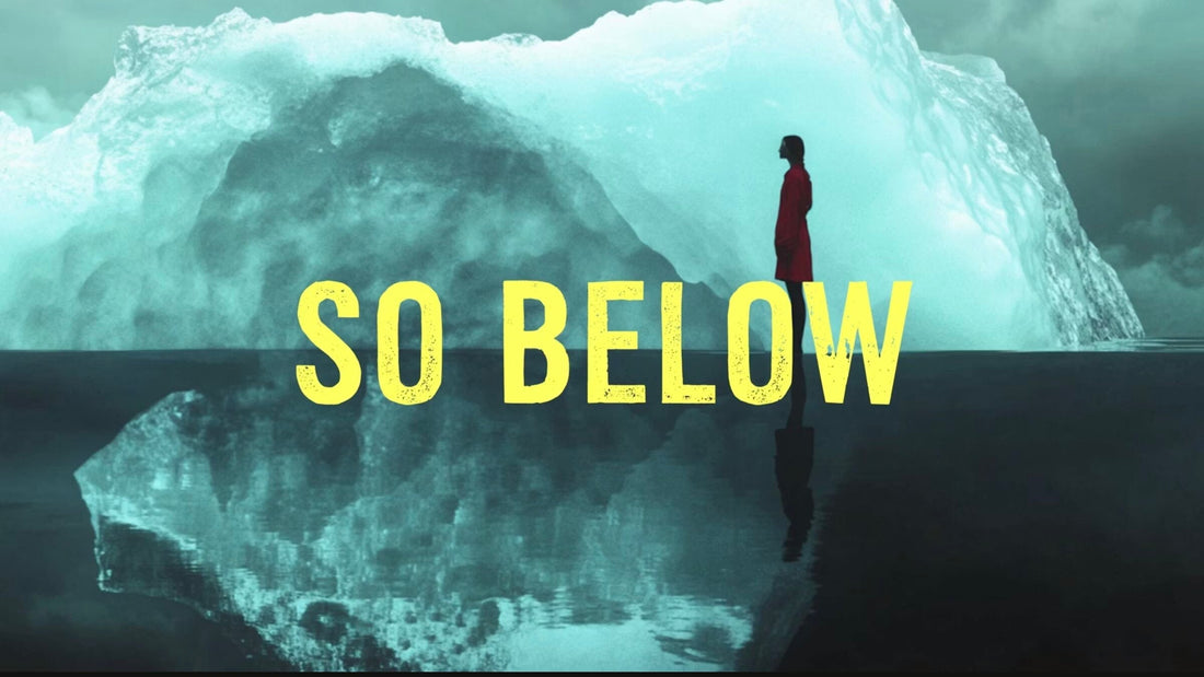 So Below iceberg concept showing a person standing above a reflected iceberg.